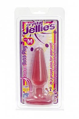 Анальная пробка среднего размера из прозрачного розового плотного материала.